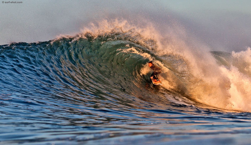 Alex Gray, December 2009. Alex Gray in the hot light of sunrise. Photo: <a href=\"https://www.surf-shot.com\" target=_blank>Surf-Shot.com</a>